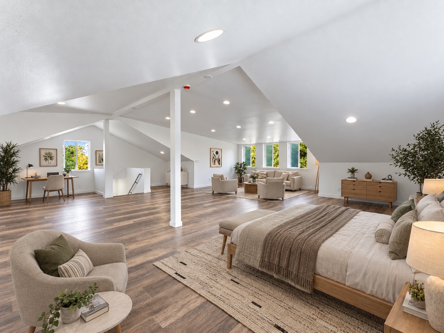 Top-floor primary suite with bed, sitting area, and desk