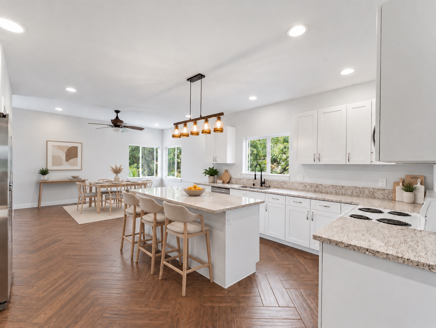 Kitchen with large island, breakfast bar, and garden windows